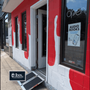 Exterior of a bookstore showing a white building with painted red drips made to look like blood.