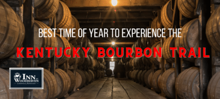 Rows of wooden bourbon barrels line the walls of a dimly lit room.