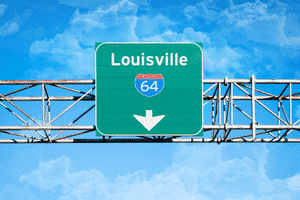 Green road sign that says Louisville Route 64